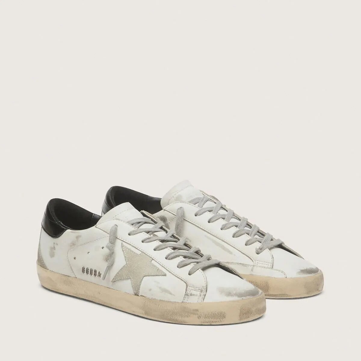 Golden Goose Super-Star Sneaker With Black Heel Tab And Metal Stud Lettering Golden Goose Super-Star Sneaker With Black Heel Tab And Metal Stud Lettering