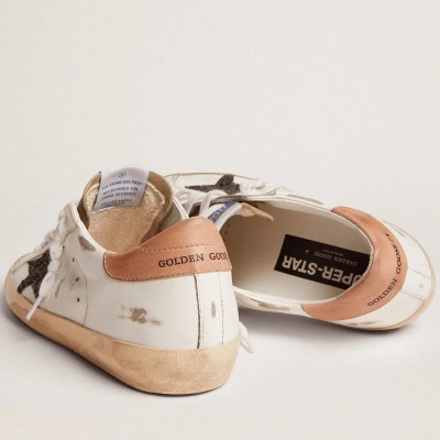 Golden Goose Super-Star Sneaker With Black Glitter Star And Pink Heel Tab Golden Goose Super-Star Sneaker With Black Glitter Star And Pink Heel Tab
