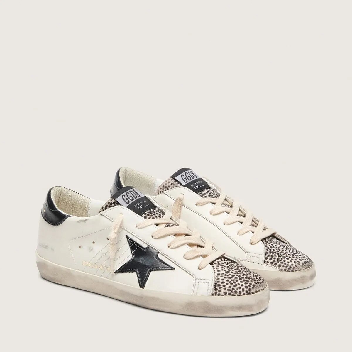 Golden Goose Super-Star Ltd Sneaker In White Leather With Black Star And Pony Skin Details Golden Goose Super-Star Ltd Sneaker In White Leather With Black Star And Pony Skin Details