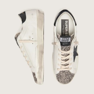 Golden Goose Super-Star Ltd Sneaker In White Leather With Black Star And Pony Skin Details Golden Goose Super-Star Ltd Sneaker In White Leather With Black Star And Pony Skin Details