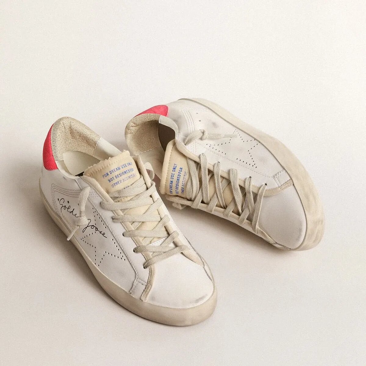 Golden Goose White Leather Super-Star Sneaker With Perforated Star And Fuchsia Nylon Heel Tab Golden Goose White Leather Super-Star Sneaker With Perforated Star And Fuchsia Nylon Heel Tab